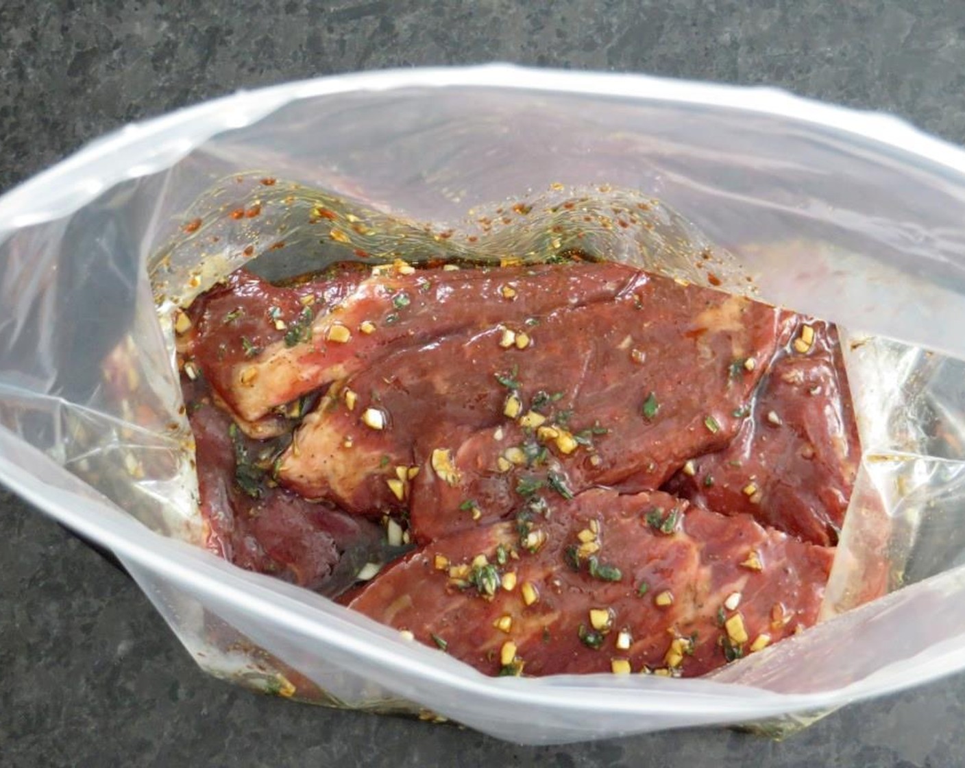 step 4 Place Flank Steak (1.5 lb) in the bag, remove as much air as possible, and seal. Flip the steak around a few times to coat with marinade. Place in the refrigerator for at least two hours and up to eight. Flip and rotate every few hours.
