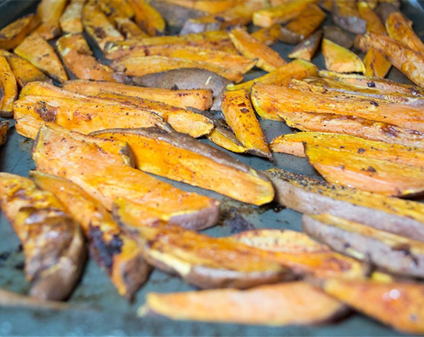 step 7 Toss with your hands to evenly coat. Spread out in single layer, and bake for 10-12 minutes, then flip and bake another 10-15 minutes or until soft and crispy, without burning.