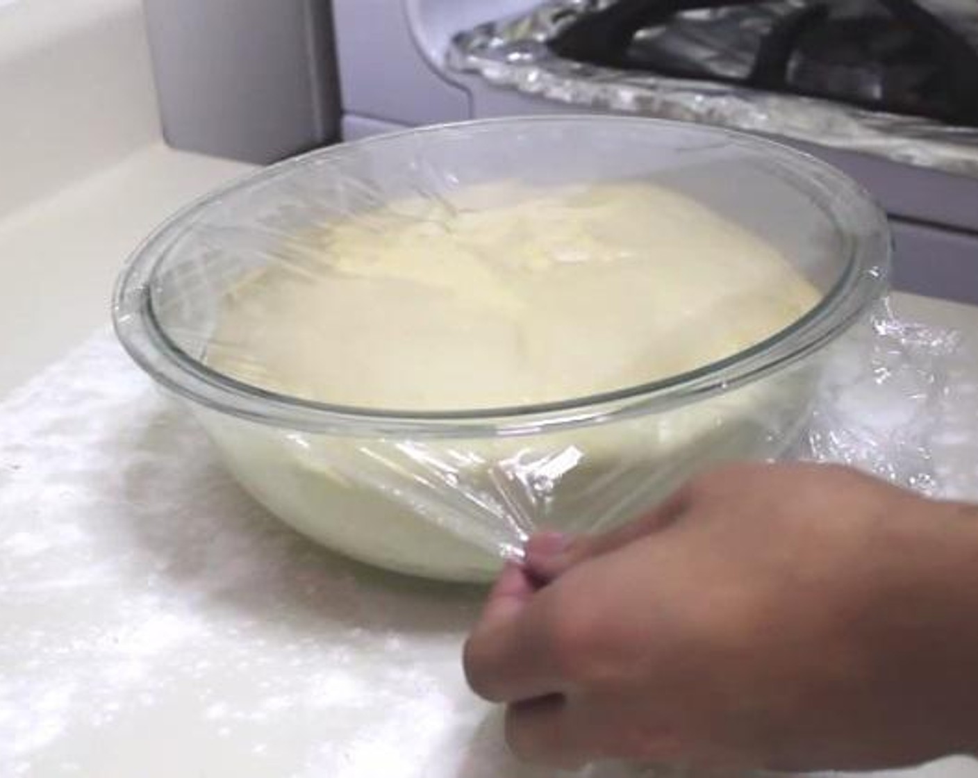 step 5 Take a plastic bowl and brush it with some oil, and put the dough inside. Cover the top with a plastic, and set aside for about one hour until the size of the dough doubles.