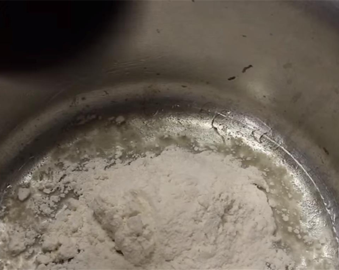 step 3 Add the flavored oil back into the pot and add in All-Purpose Flour (4 Tbsp).