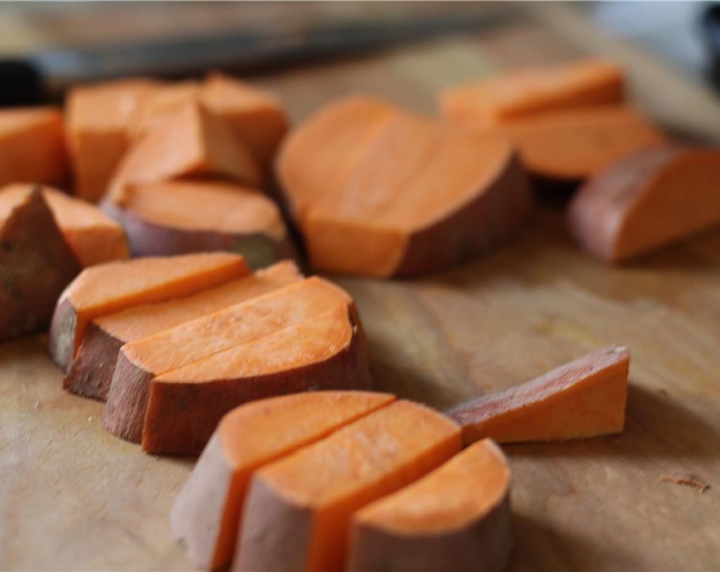 step 2 Chop the Sweet Potatoes (3) into large wedges.