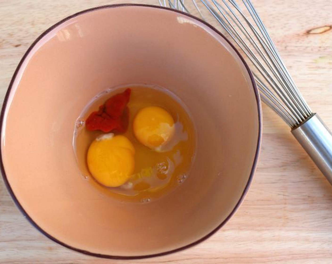 step 3 In a separate bowl, whisk together the Eggs (2), Sriracha (1 Tbsp), and Kosher Salt (to taste).