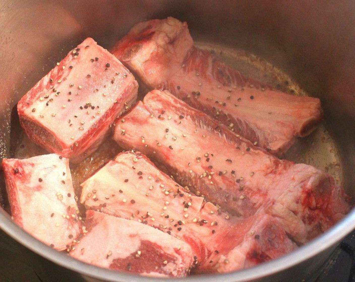 step 1 Season Beef Short Ribs (8) with Kosher Salt (to taste), Freshly Ground Black Pepper (to taste) and Granulated Garlic (to taste) in Peanut Oil (2 Tbsp). Sauté all sides until golden brown 1 layer at a time.