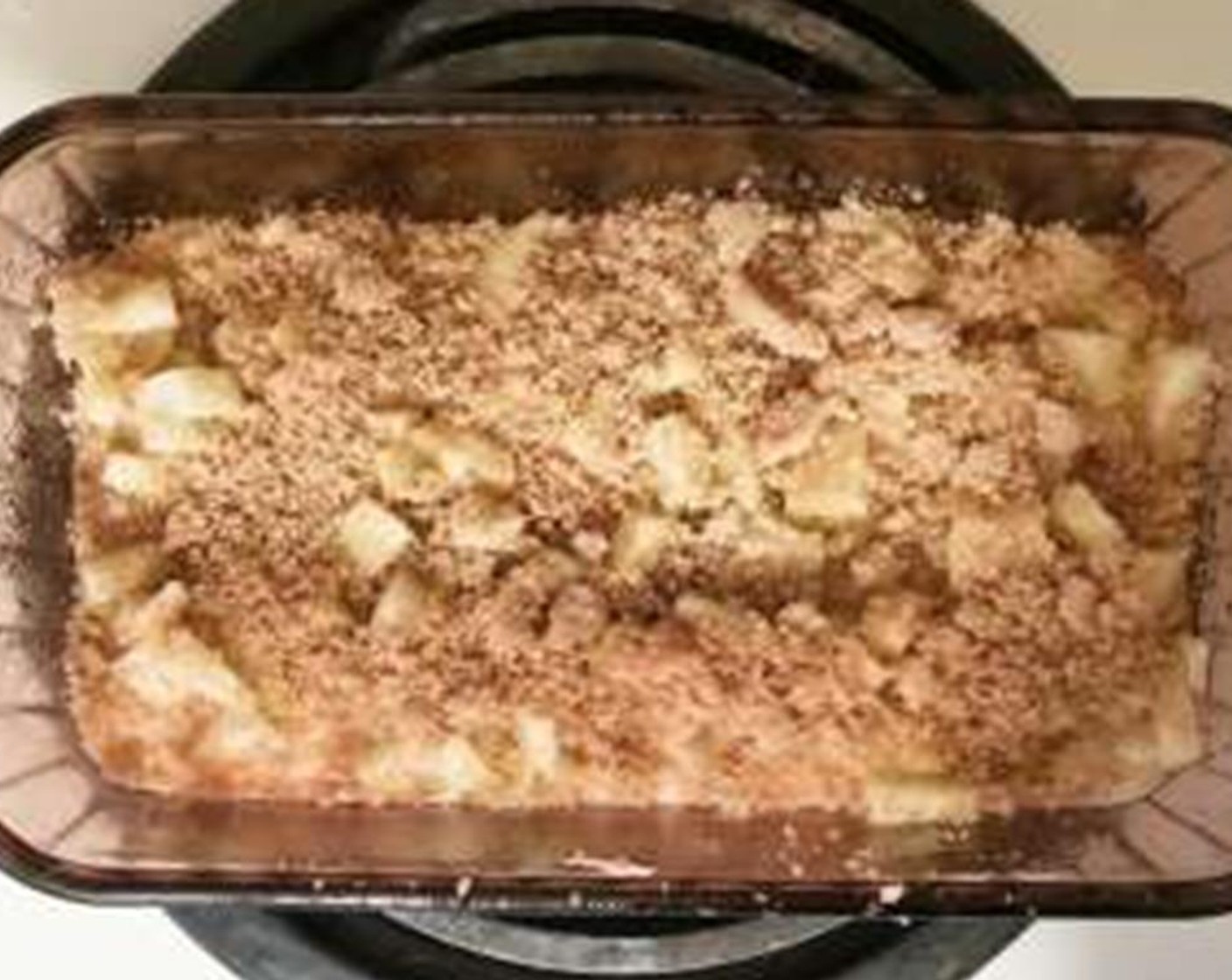 step 4 Eyeball about half the batter and spread it into a greased loaf pan. Top that with half the apples and half the cinnamon sugar topping. Spread the second half of the batter on top, then top with apples and cinnamon sugar.