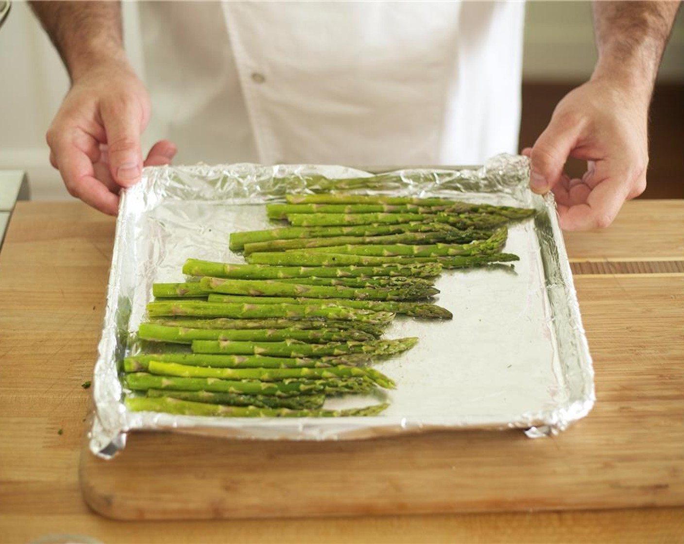 step 23 Roast asparagus in a single layer for ten minutes, then remove from oven.