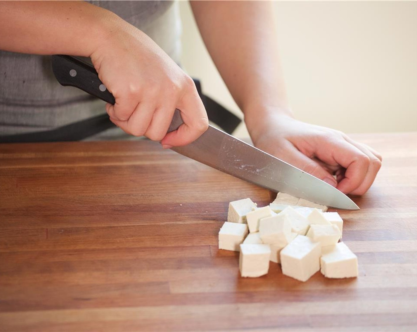 step 3 Pat dry Extra Firm Tofu (14 oz) with paper towels. Slice into one inch cubes, and set aside.