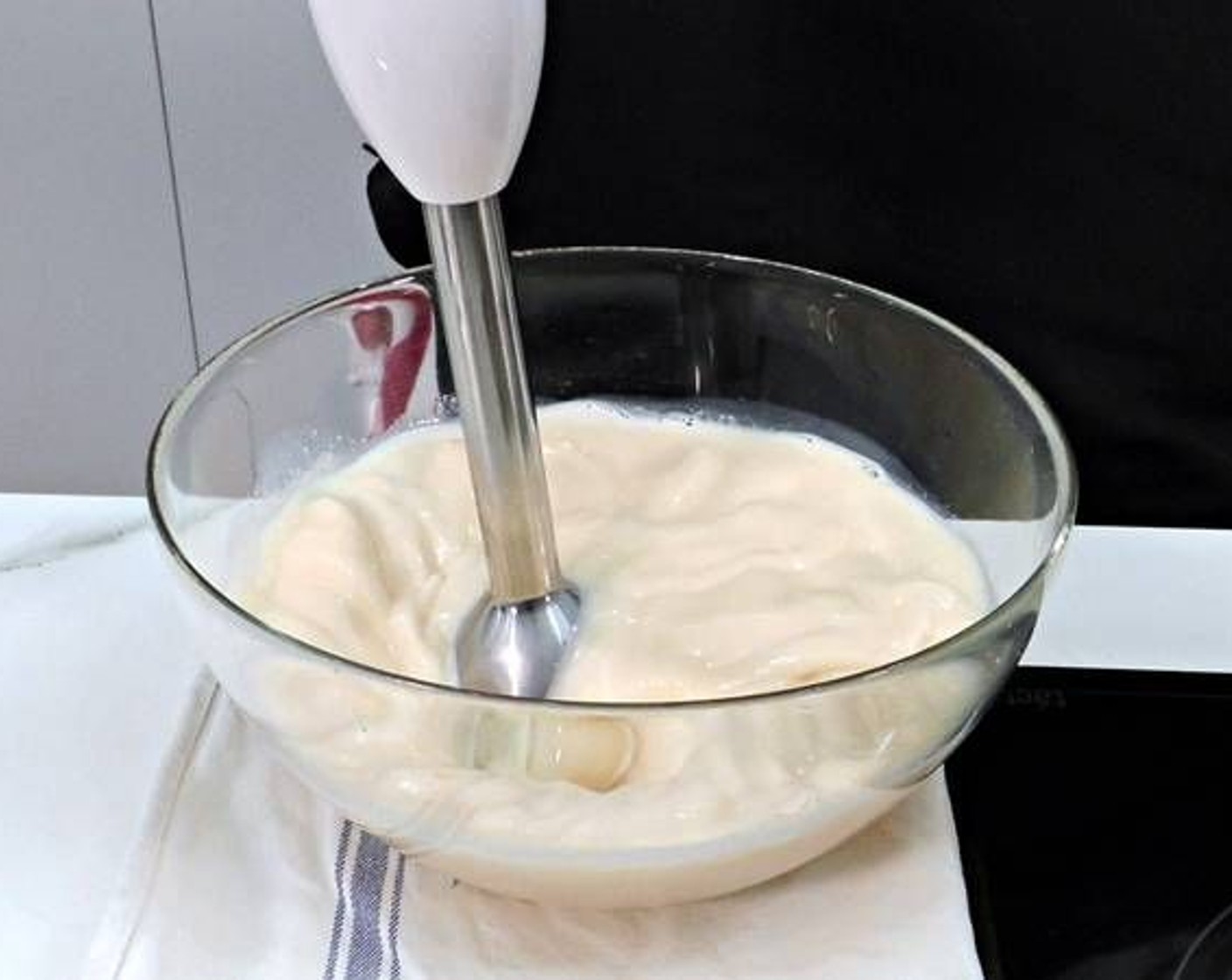 step 3 While the caramel cools, in a large bowl add the Eggs (4), Milk (3 cups), and Granulated Sugar (1/4 cup). Following that, blend using a stick blender to mix it all together.