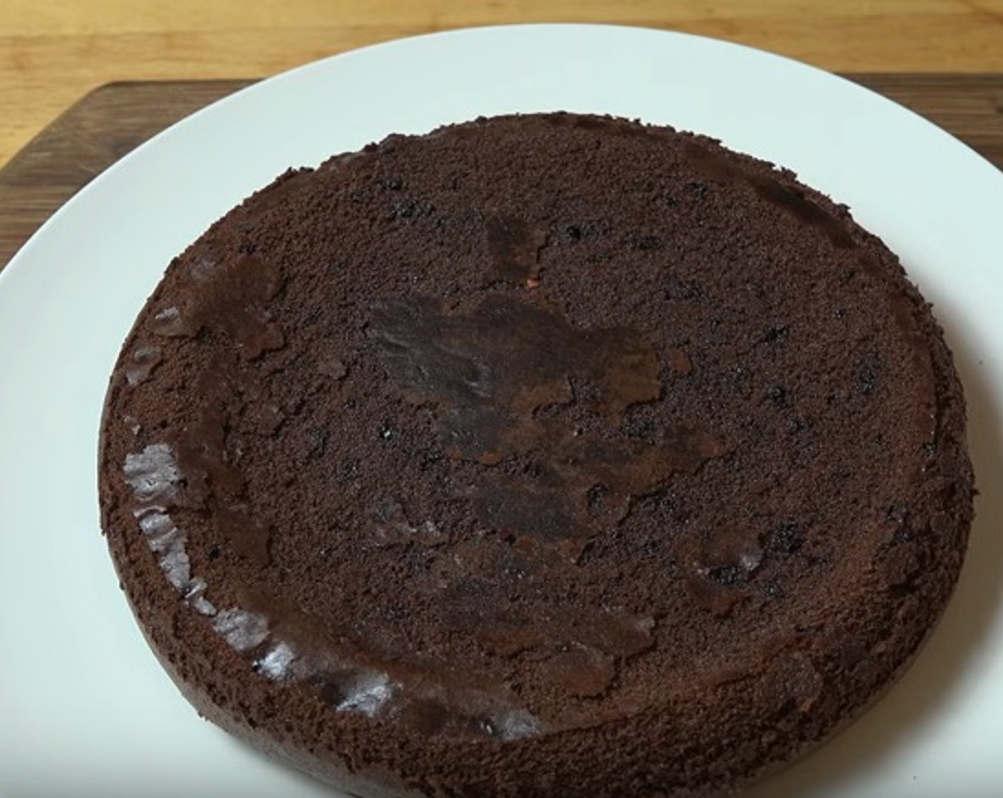 step 8 Run a knife along the outside edge to separate the cake from the tin, then place a serving plate over the top and flip gently. Lift the tin and remove baking paper.