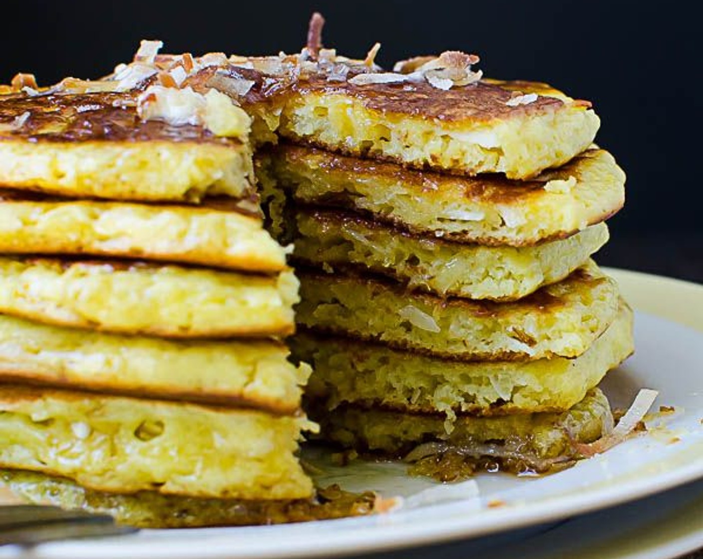 step 9 Add a pat of butter to a stack of pancakes, sprinkle with a little coconut and add Maple Syrup (to taste).