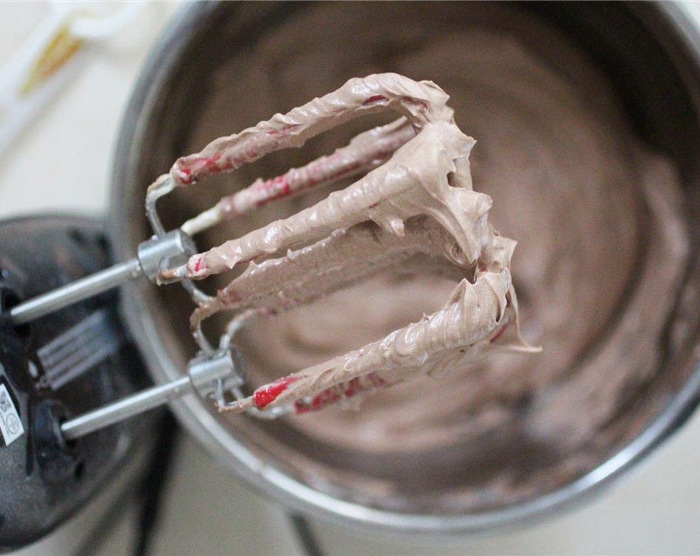 step 8 Add more Unsweetened Cocoa Powder (2 Tbsp) and Unsweetened Almond Milk (2 Tbsp) and beat until smooth. Add the Powdered Confectioners Sugar (2 1/2 cups), one cup at a time, taste testing as you go.