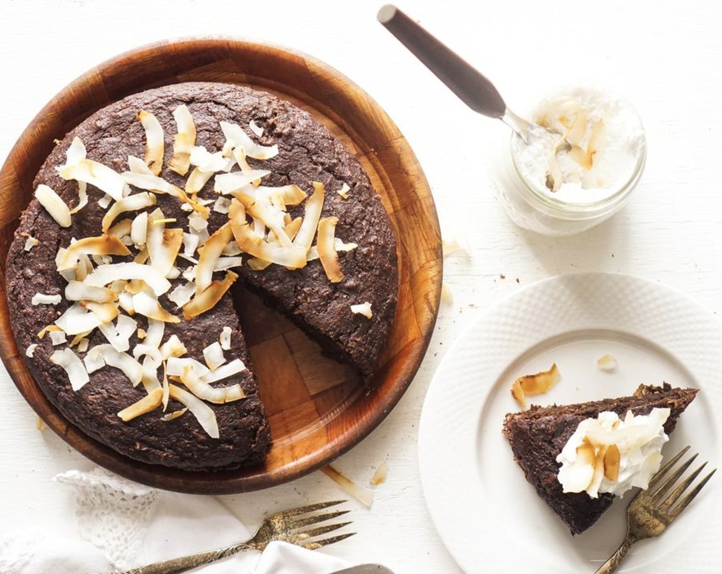 step 7 Slice into 10-12 pieces and top with toasted coconut flakes and Whipped Cream (to taste), if desired.