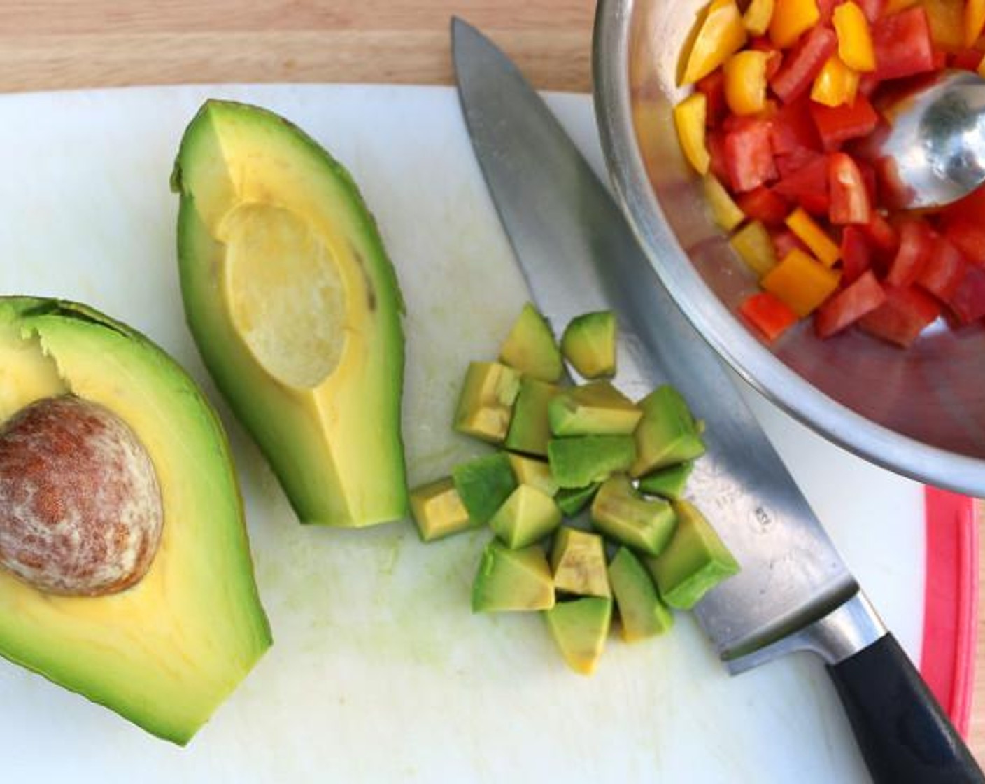 step 2 Dice the Avocado (1), Red Chili Pepper (1/2) and Yellow Bell Pepper (1/2). Then, add juice from Lime (1/2), Olive Oil (2 Tbsp), Kosher Salt (to taste) and Cayenne Pepper (to taste).