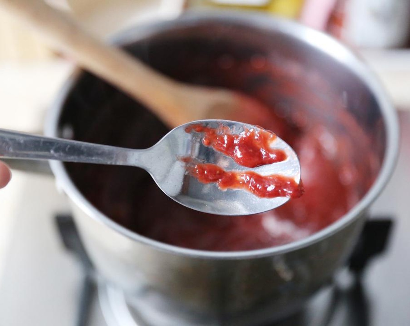 step 4 Begin testing to see if the jam is done by placing a small amount of jam on a cold spoon, waiting a few seconds for it to cool and then running your finger through the jam to see if it leaves a clear track. If it does, then the jam is done, if not, continue cooking until done.