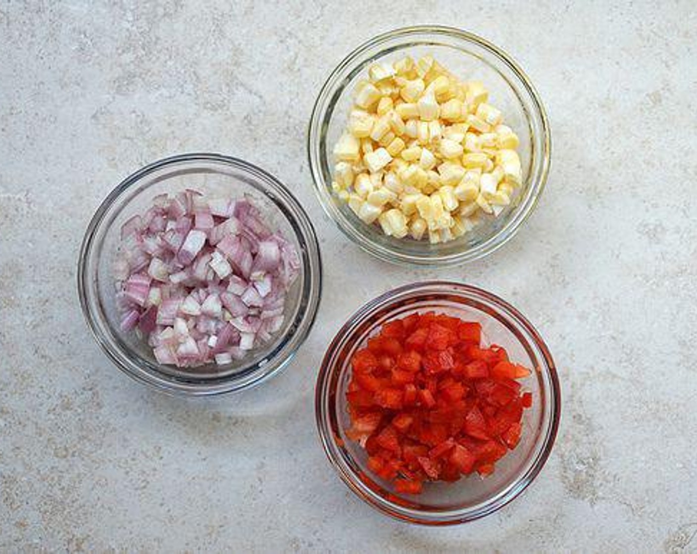 step 4 While quinoa is cooking, prepare your Corn (1/2 cup), shallot and red pepper. Finely dice Shallot (1/2 cup) and Red Bell Pepper (1/2 cup), they should be about the same size as the corn kernels.