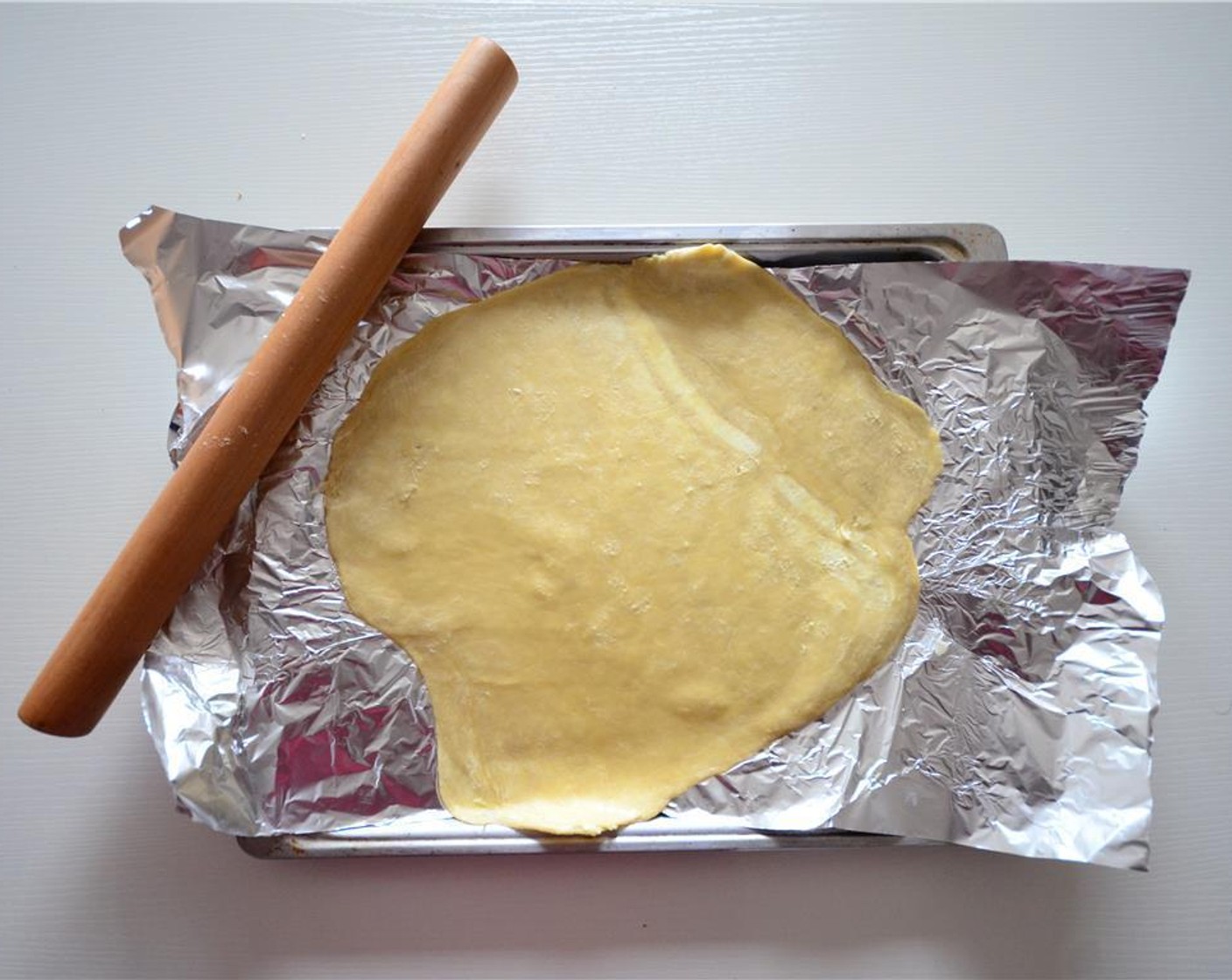 step 1 Roll out the Puff Pastry (1 pckg) on a piece of parchment paper. Cover with aluminum foil and store it in the refrigerator.