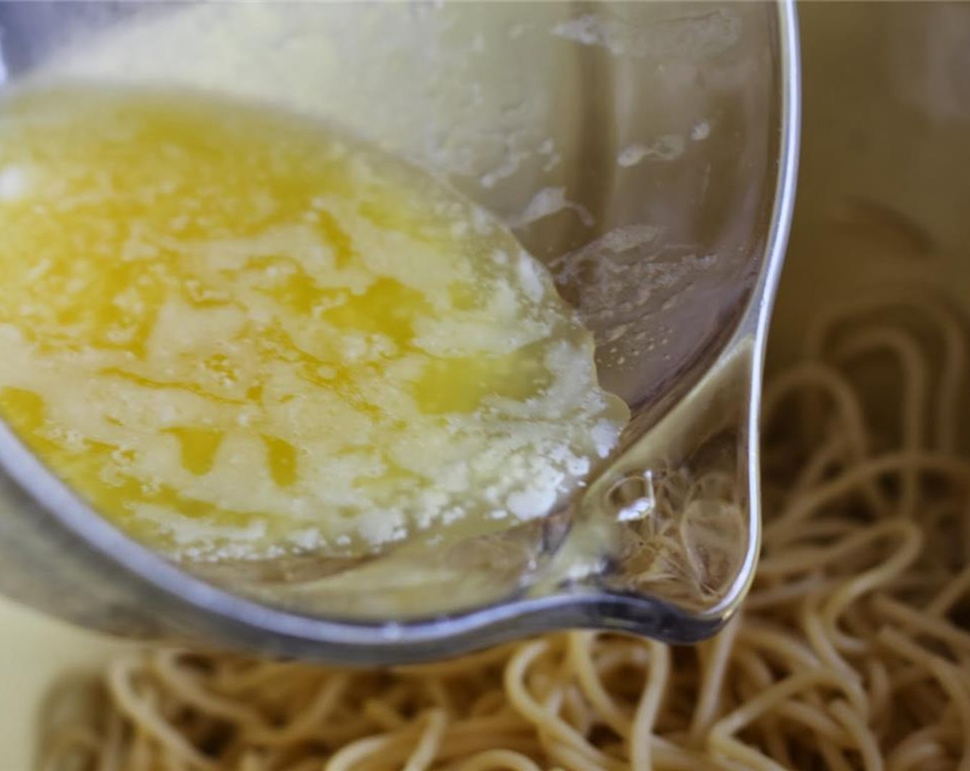 step 2 Make the crust: Mix together Spaghetti (4 cups) and Butter (1/3 cup).