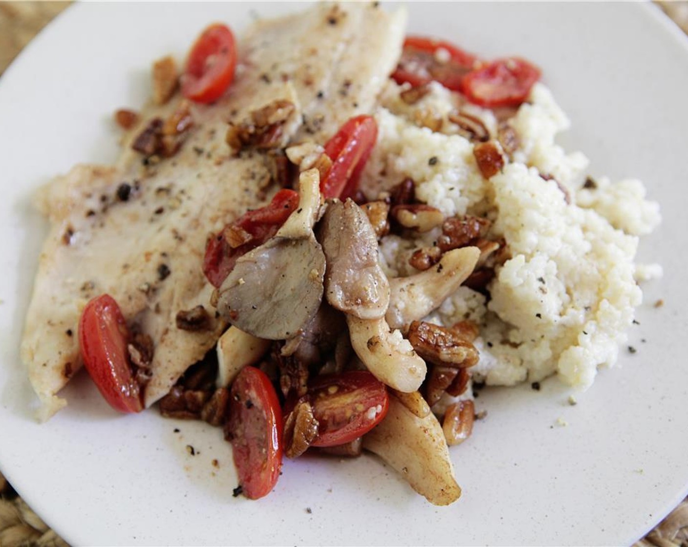 step 9 Top trout with the oyster mushrooms and pecan mixture and serve along side a helping of gouda grits. Enjoy!