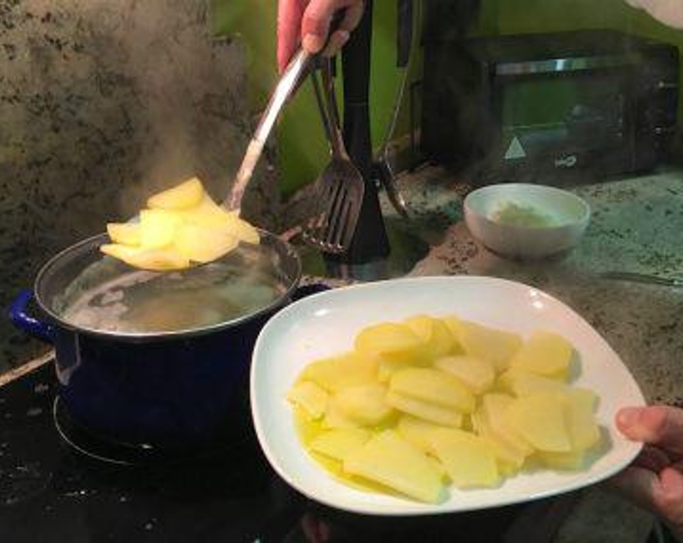step 4 Remove potatoes with a slotted spoon onto a plate and set aside to cool.