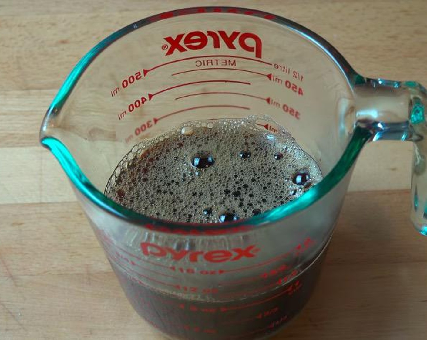 step 1 In a mixing glass, add Coffee (1 cup), half of the Powdered Confectioners Sugar (3/4 cup) and Coffee Liqueur (2 Tbsp). Stir with a spoon until combined. Reserve 3 tablespoons of the mixture for later.