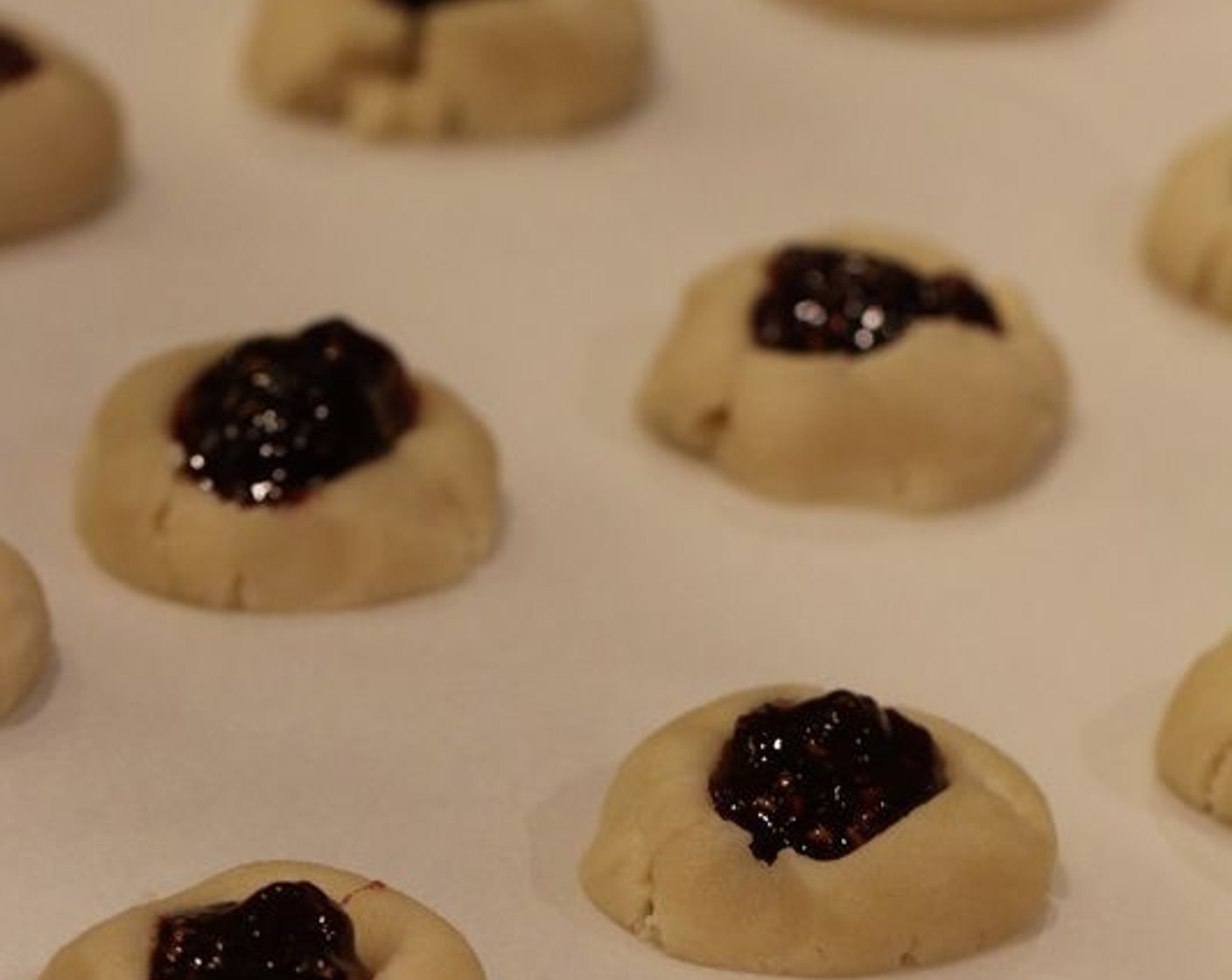 step 7 Fill each impression with a scant 1/2 tsp of Jam (1/2 cup). Place prepared cookies in the refrigerator for 30 minutes or freeze for 10 minutes – this step is MANDATORY!