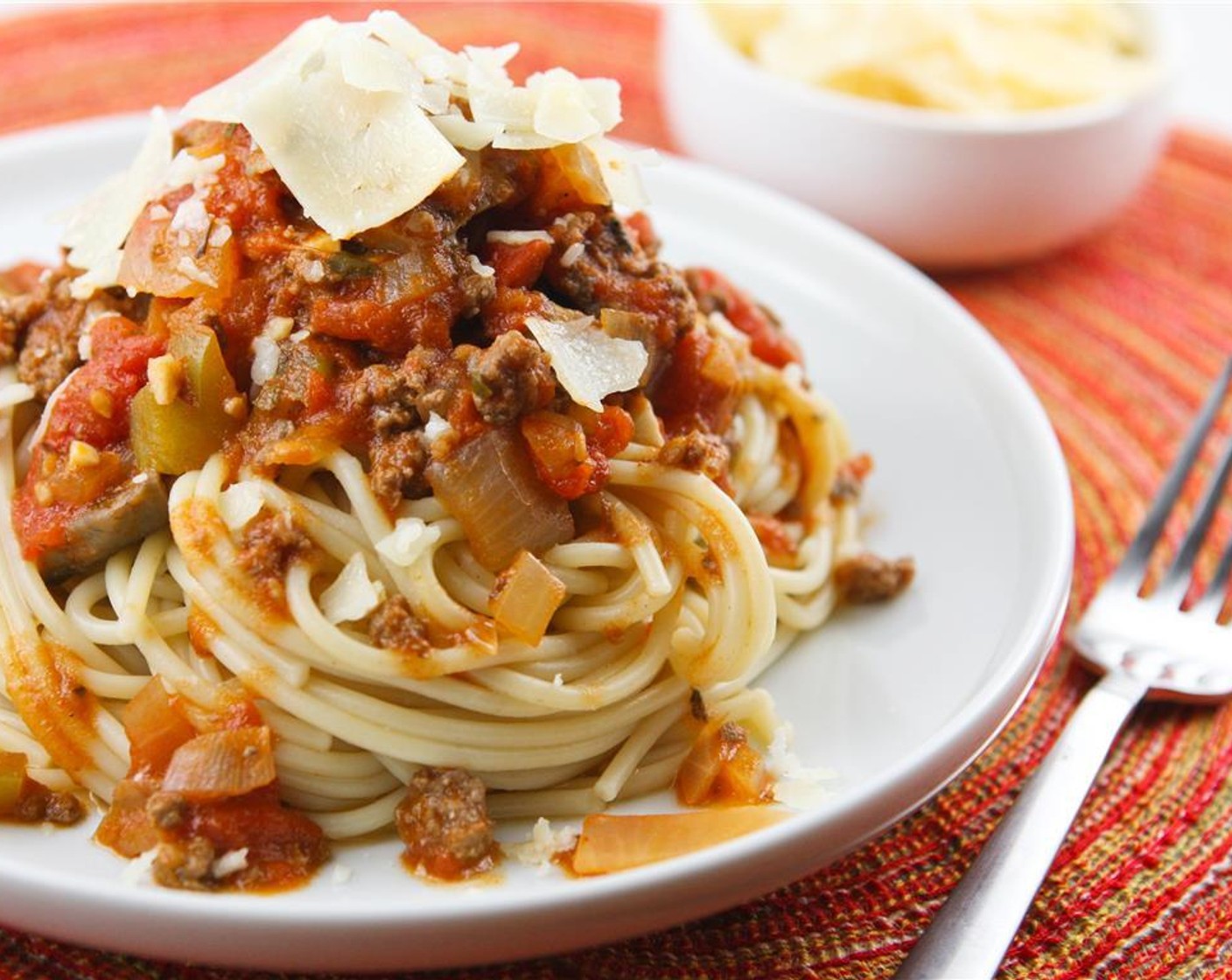 step 6 Pour over cooked spaghetti and top with shaved Parmesan Cheese (to taste).