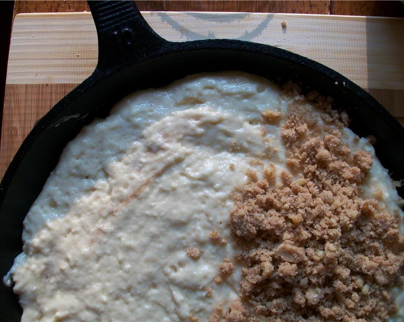 step 6 Combine remaining Unsalted Butter (1/2 cup), Brown Sugar (1/2 cup), Simply Organic Cinnamon, Ground (1 Tbsp), walnuts, and remaining All-Purpose Flour (4 Tbsp) with a pastry blender or fork until crumbly. Sprinkle over top of cake.