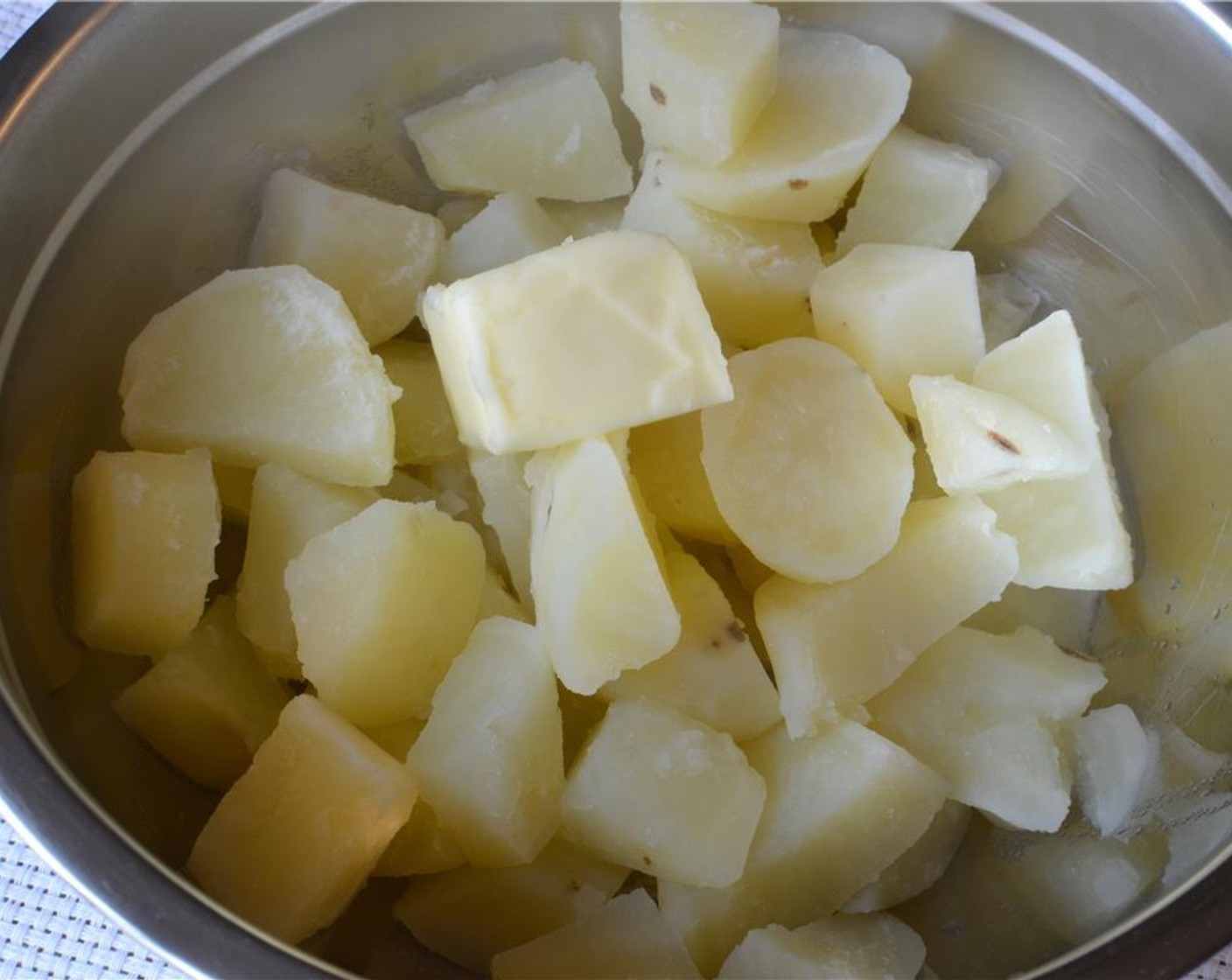 step 8 Peel, cut and boil Potatoes (4) in well-salted water. Then drain them and toss them in a mixing bowl.