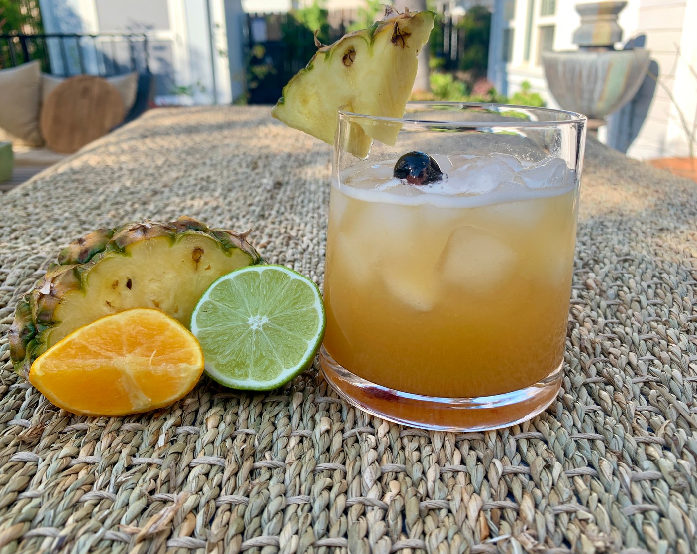 step 2 Pour into a glass or jar, then add the Pineapple (1 slice), Orange (1 slice), Lime (1 slice), and top with a Luxardo Cherry (1).