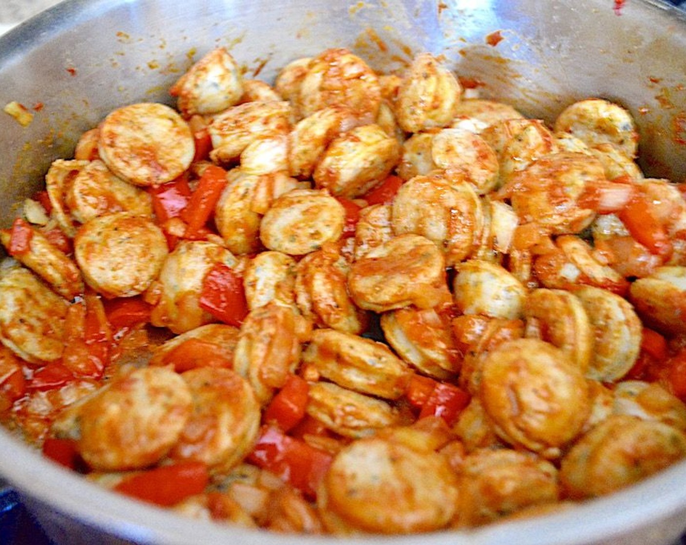 step 2 Add in the Red Bell Pepper (1) and Onion (1). Let them get soft and fragrant for another couple of minutes while you season everything with the Cajun Seasoning (1 Tbsp) and Salt (1 pinch).