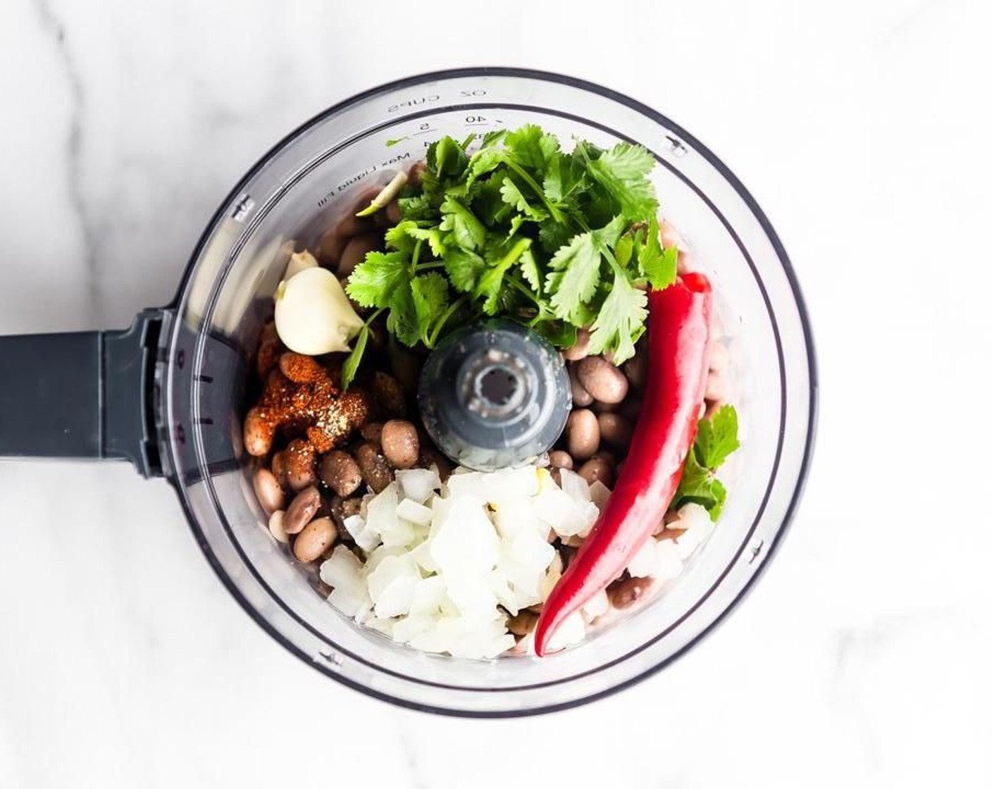 step 1 First, blend together Canned Pinto Beans (2 cups) Garlic (2 cloves), Red Chili Pepper (1), Salt (1/4 tsp), Ground Black Pepper (1/4 tsp), Onion (1/2 cup), and Smoked Paprika (1 tsp).