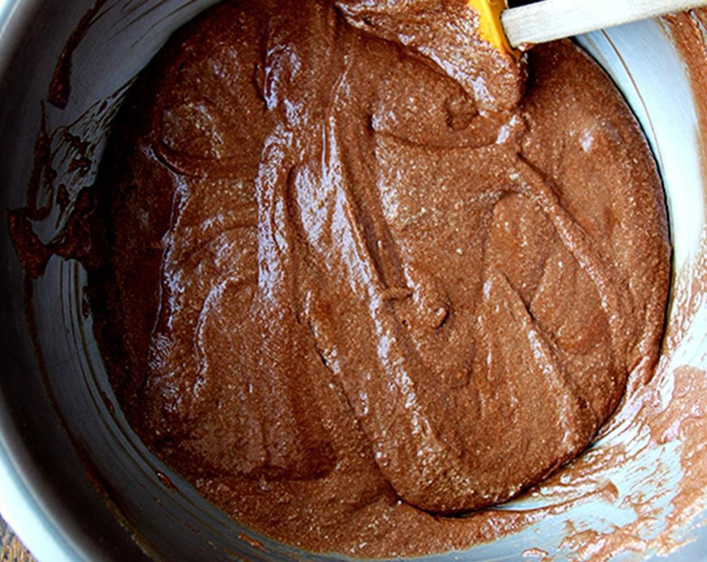 step 5 Remove from heat and place the bowl of whipped egg yolks within the bowl of ice water and beat until cool and thick. Then fold the chocolate mixture into the egg yolks.