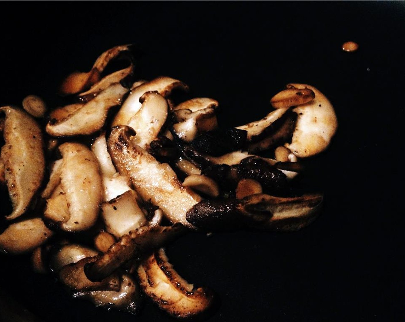 step 6 In the same pan, toss in the shiitake mushrooms to deglaze the pan. Allow the mushrooms to sear and golden before adding to the bowl with sausage.