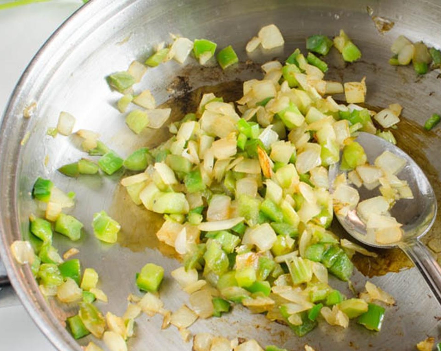 step 5 Add Olive Oil (1 Tbsp) to the same skillet over medium-high heat. Add half of the Onion (1/3 cup) Green Bell Pepper (1/3 cup), Celery (1/3 cup) and diced jalapeño pepper. Sauté until vegetables are tender and slightly translucent. Stir in Salsa Verde (1 1/4 cups).