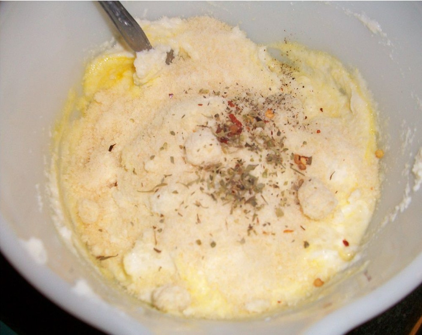 step 4 In a medium bowl, combine Part-Skim Ricotta Cheese (1 3/4 cups), Egg (1), Parmesan Cheese (1/4 cup), Italian Seasoning (1 pinch), Crushed Red Pepper Flakes (1 pinch), and Ground Black Pepper (1 pinch) and whisk until the mixture is fluffy.