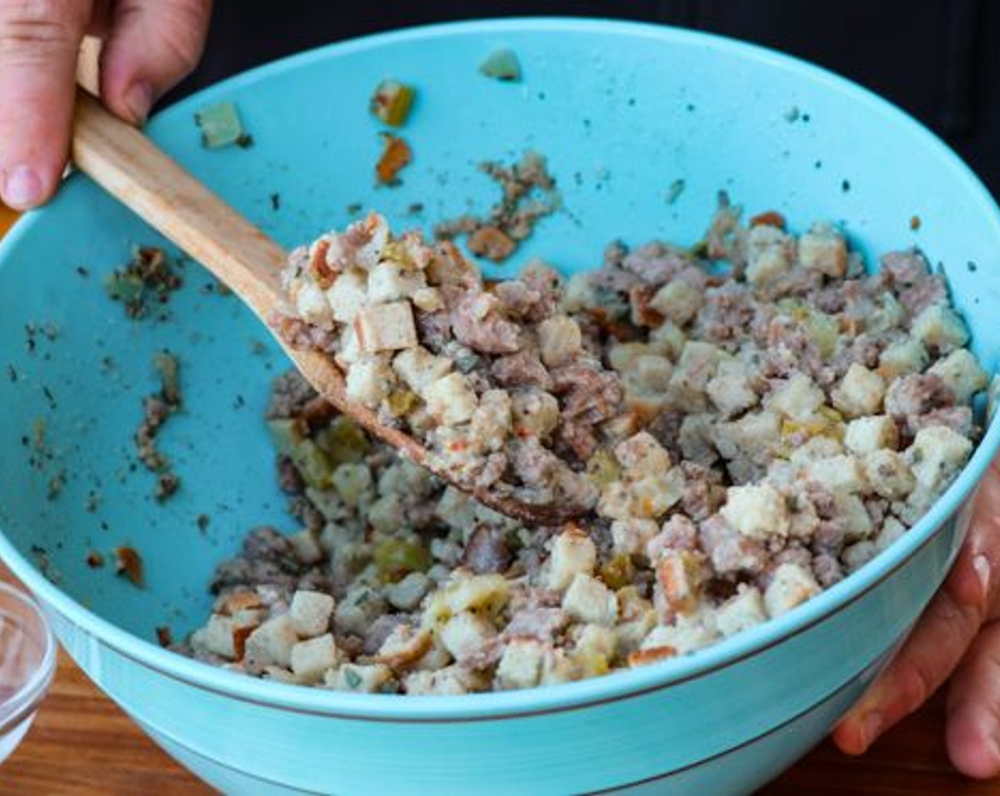 step 5 In a large bowl combine the Seasoned Breadcrumbs (4 1/3 cups) with sausage, sautéed mixture, Butter (1/2 cup), Eggland's Best Classic Egg (1), Fresh Rosemary (1 tsp), Fresh Thyme (1 tsp), Fresh Sage (1 tsp), All-Purpose Spice Rub (1 tsp) and Chicken Broth (22 fl oz). Stir to incorporate and stuff into the cavity of the turkey. Tie the legs together with butcher twine to hold in the stuffing.