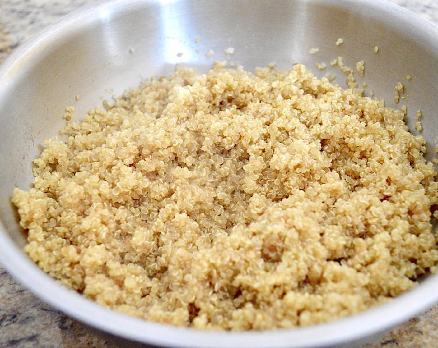 step 1 Get a medium sauce pan and bring the Chicken Stock (540 mL) to a boil in it on the stove. Once it is boiling, stir in the Quinoa (210 g). Put a lid on the pot and turn the heat to low. Let the quinoa cook for 12-15 minutes, until it is tender and the little tendrils pop out. When it is done, fluff it up with a fork. While the quinoa cooks, prepare the rest of the salad