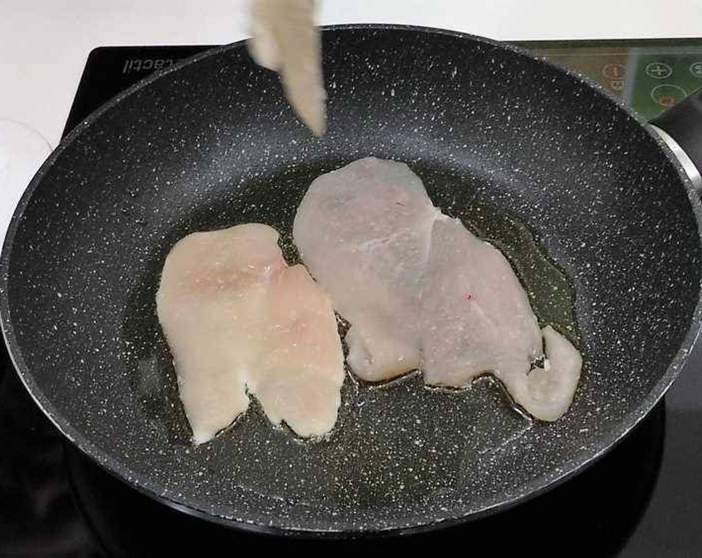 step 1 Start by seasoning with Salt (to taste) and pan-frying the Boneless, Skinless Chicken Breasts (2) in some Olive Oil (as needed).