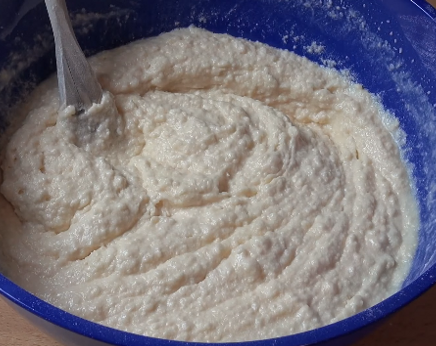 step 2 Add in the Eggland's Best Classic Eggs (2) one at a time, beating after each one. Sift in Self-Rising Flour (2 cups) and add Unsweetened Shredded Coconut (1 cup). Stir. Add Vanilla Extract (1 tsp) and Milk (1 cup). Stir again. Gently fold in Sprinkles (4 Tbsp).