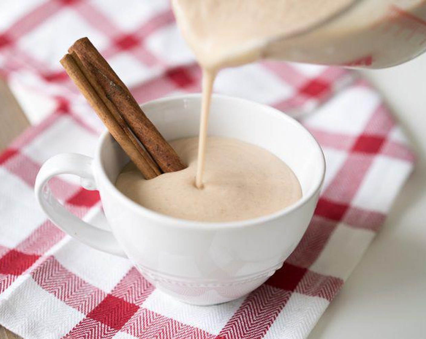 step 1 Place Banana (1), Coconut Milk (1 2/3 cups), Almond Milk (1 1/2 cups), Dark Pure Maple Syrup (4 Tbsp), Simply Organic Cinnamon, Ground (1 tsp), Ground Nutmeg (1/4 tsp), Ground Cloves (1/8 tsp) and Vanilla Powder (1/2 tsp) into a high power blender and give it a whirl. Top with more freshly grated cinnamon.