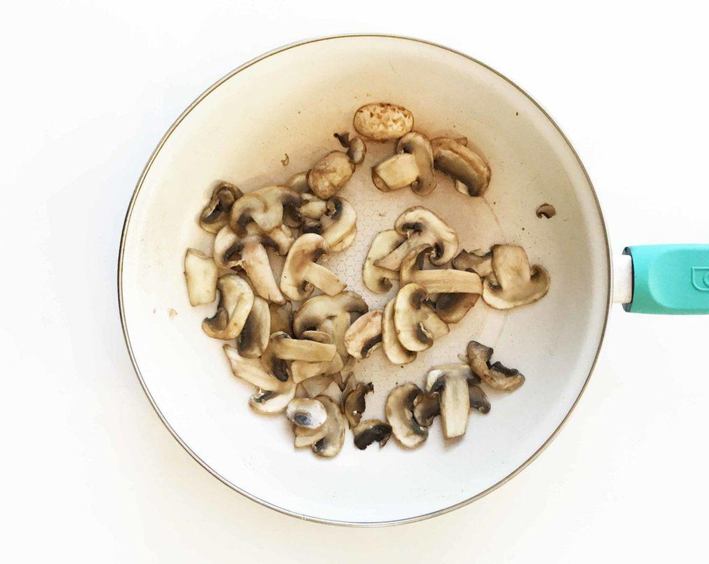 step 3 Place the sliced mushrooms in a medium skillet and cook down until tender.