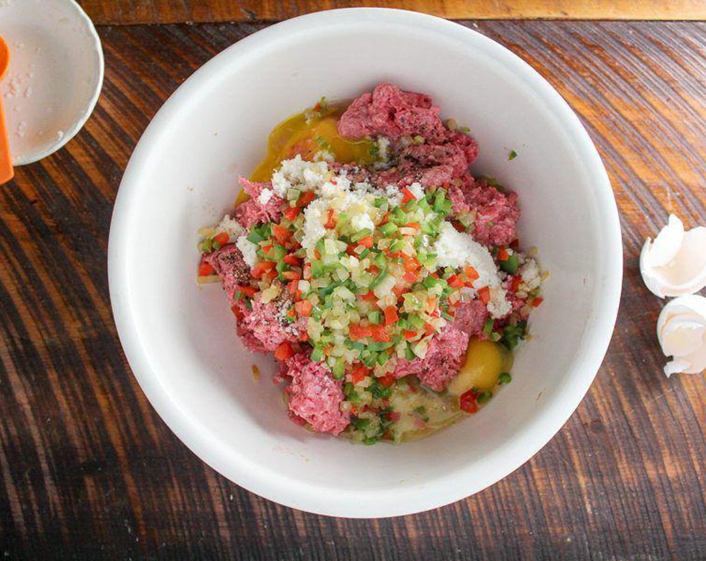 step 3 In a large bowl, combine the Lean Ground Beef (2 lb), pepper, onion, Eggland's Best Classic Eggs (2), bread crumb mixture, Worcestershire Sauce (2 Tbsp), Salt (1/2 tsp), Ground Black Pepper (1/2 tsp) and Simply Organic Garlic Powder (1/2 tsp).