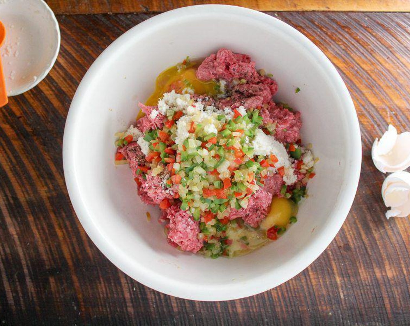 step 3 In a large bowl, combine the Lean Ground Beef (2 lb), pepper, onion, Eggs (2), bread crumb mixture, Worcestershire Sauce (2 Tbsp), Salt (3/4 tsp), Ground Black Pepper (1/2 tsp) and McCormick® Garlic Powder (1/2 tsp).