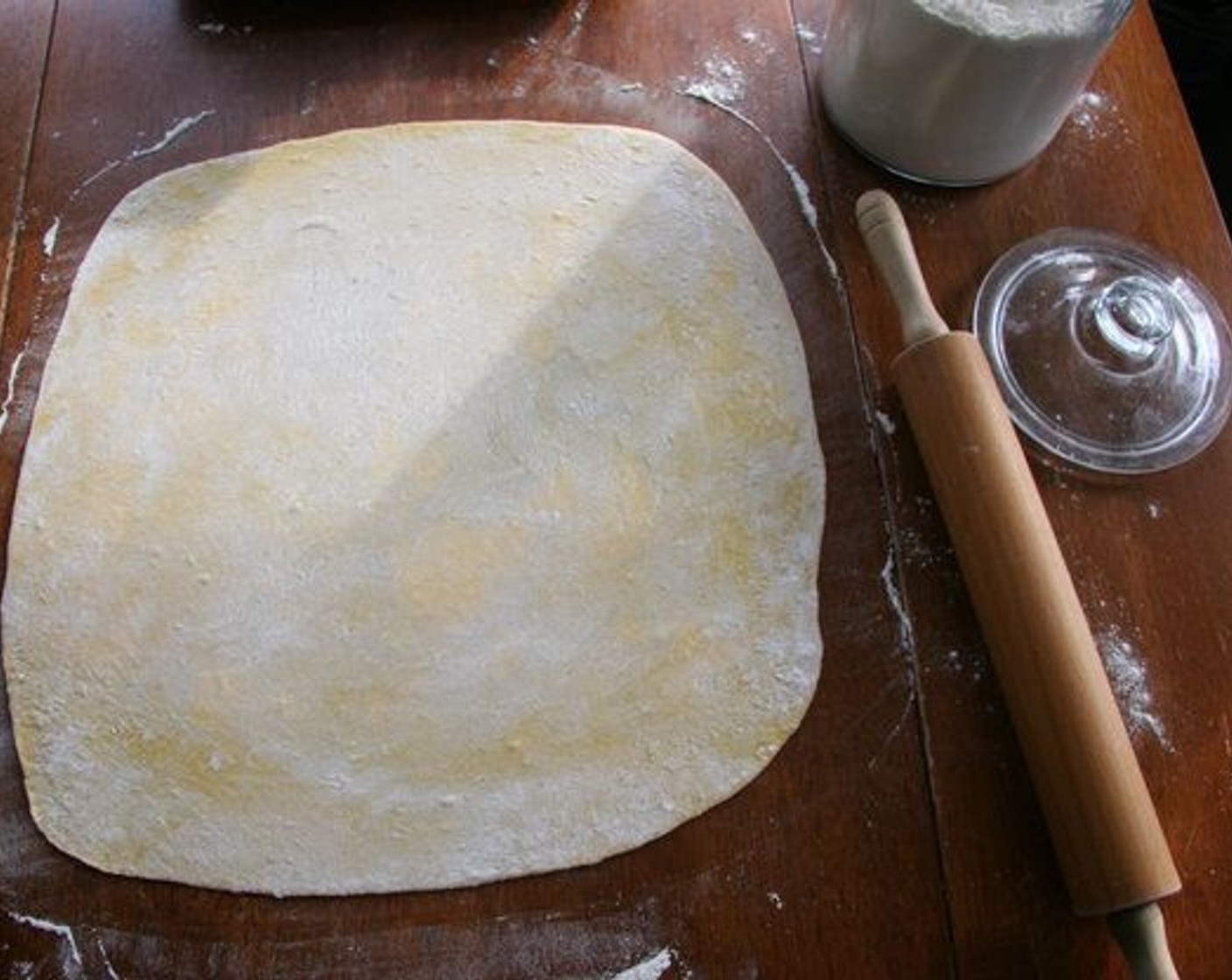 step 2 Roll dough out as thin as you possibly can on a surface covered with Unbleached All-Purpose Flour (1/4 cup).