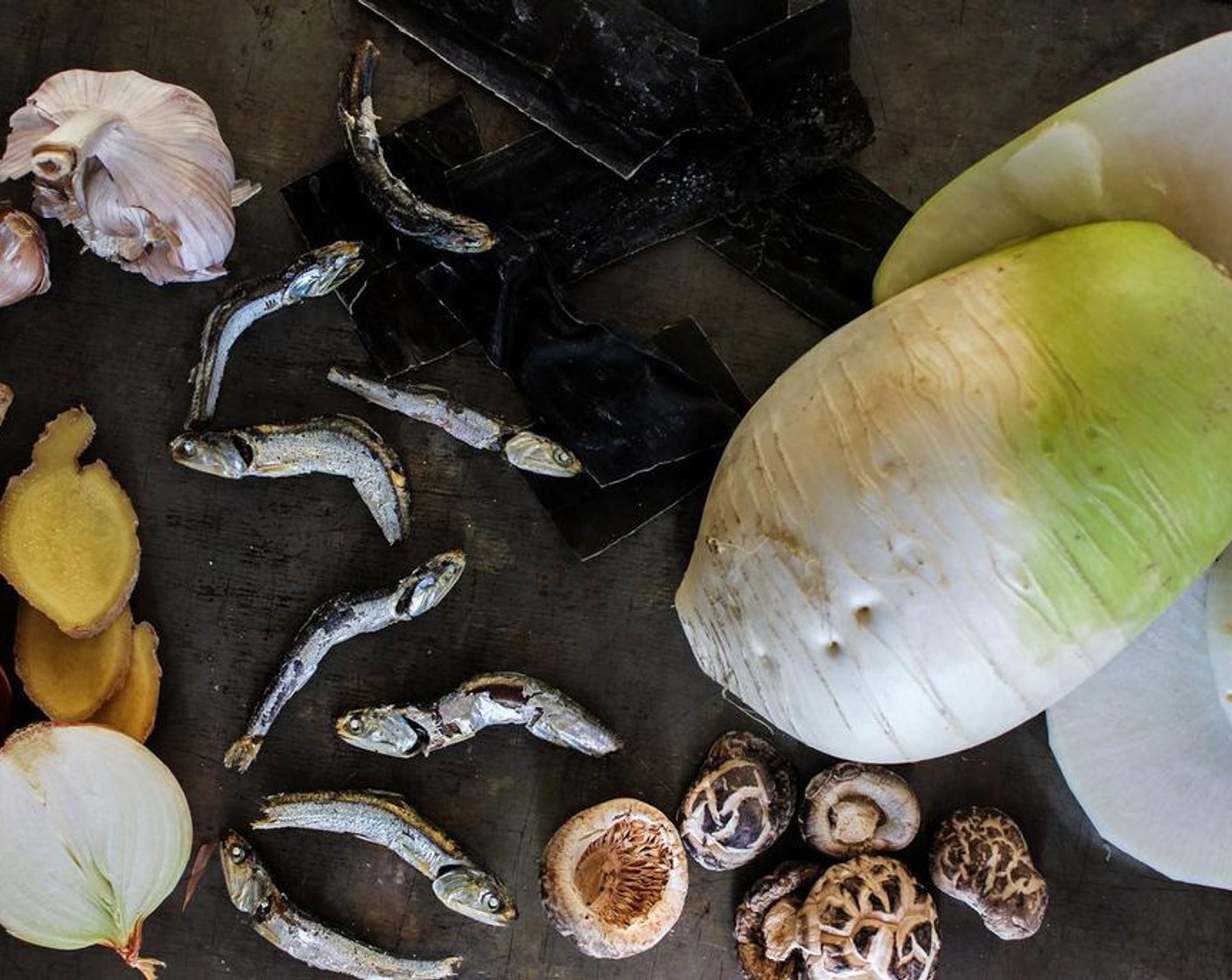 step 1 In a pot, combine the Water (6 cups), Korean Radish (to taste), Fresh Ginger (2 slices), Onion (1/2), Dried Anchovies (8), Garlic (2 cloves), Shiitake Mushrooms (4), and Kombu (to taste) into a pot and boil for approximately 30 mins on medium heat.