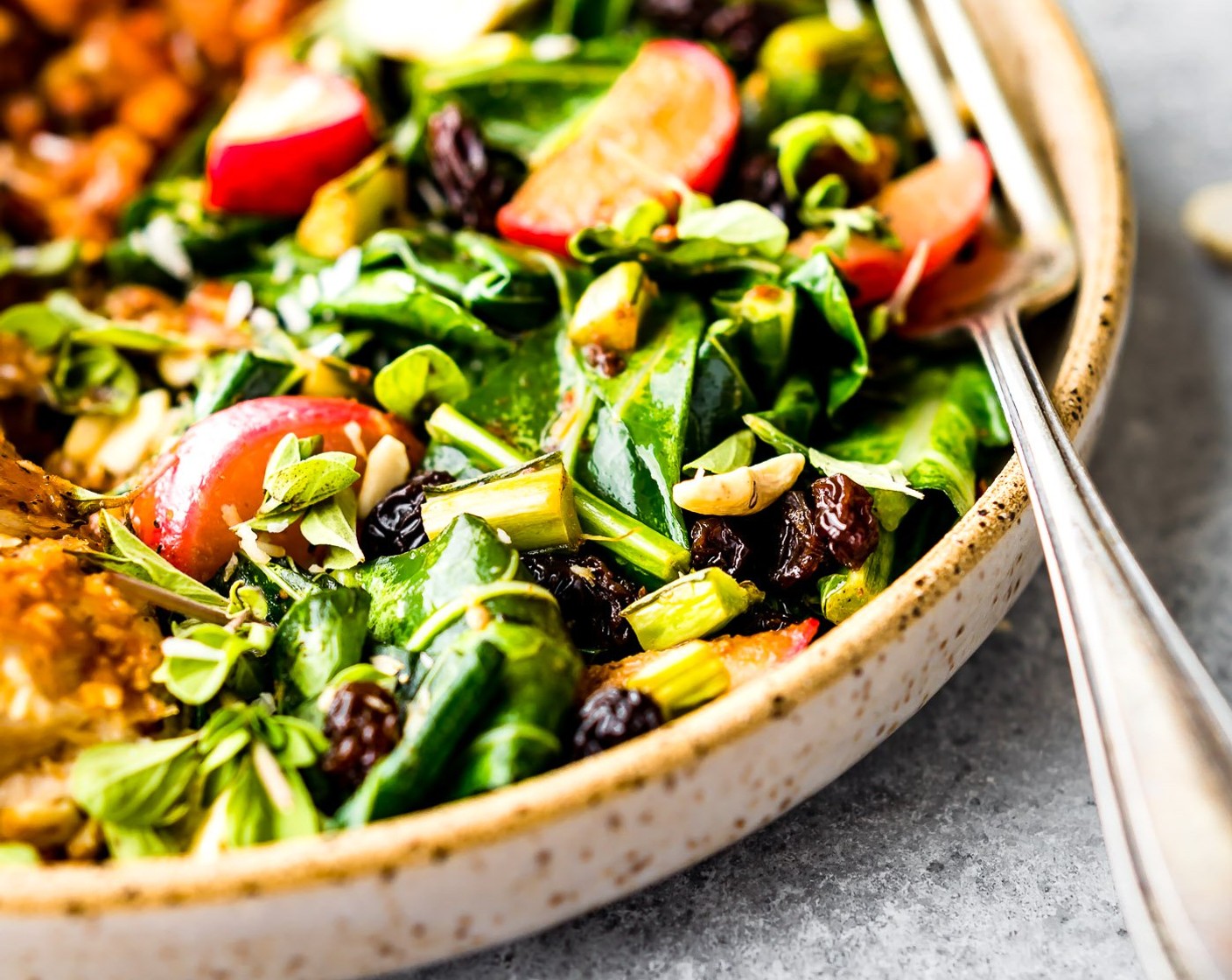 step 13 To serve, cut chicken into 6-8 slices each. Divide sweet potatoes and collards between plates. Place roasted potatoes and collards between plates. Fan chicken over top and drizzle with remaining vinaigrette. Sprinkle with toasted coconut and cashews.