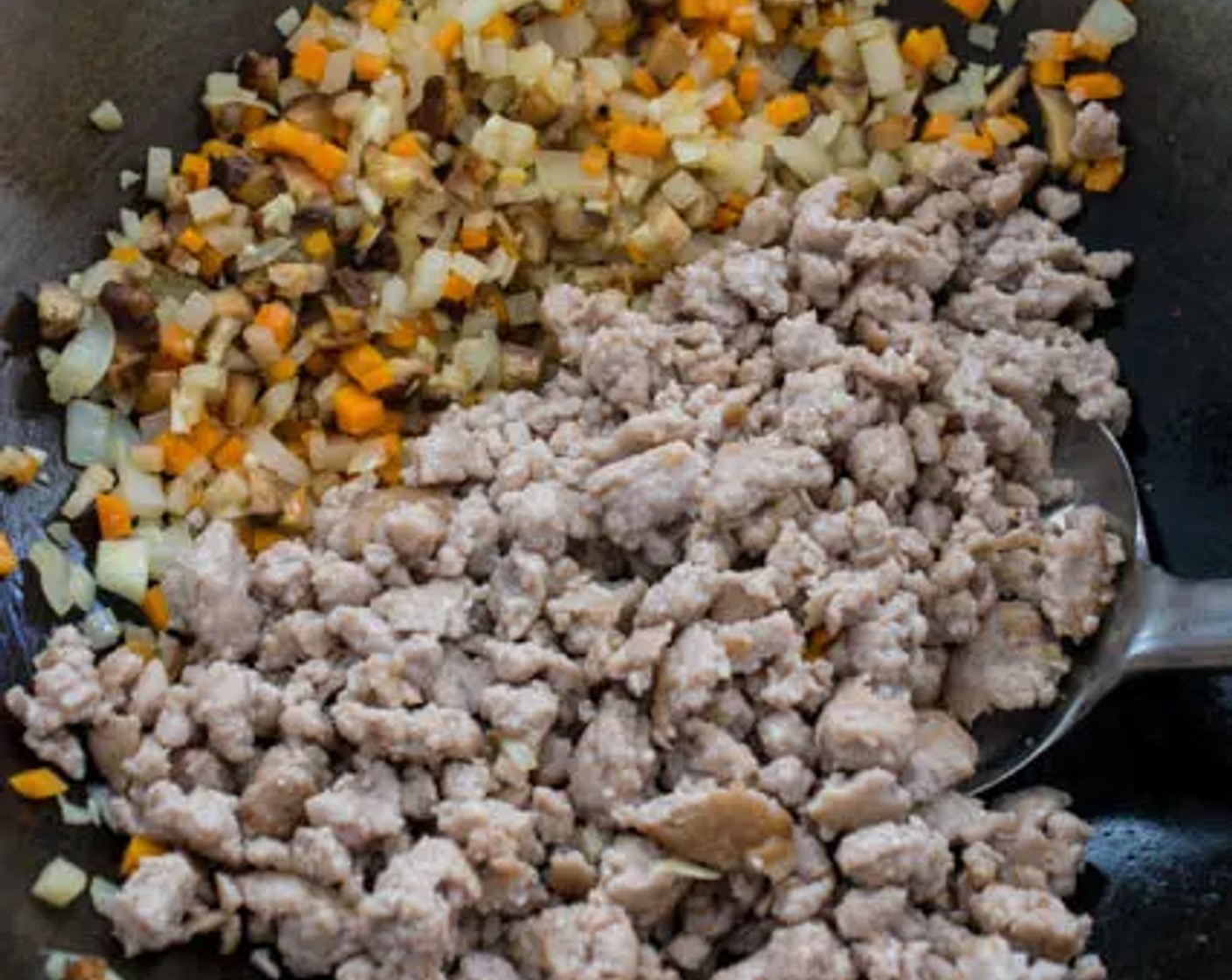 step 9 Return the ground pork to the wok, then stir-fry to combine all the ingredients.