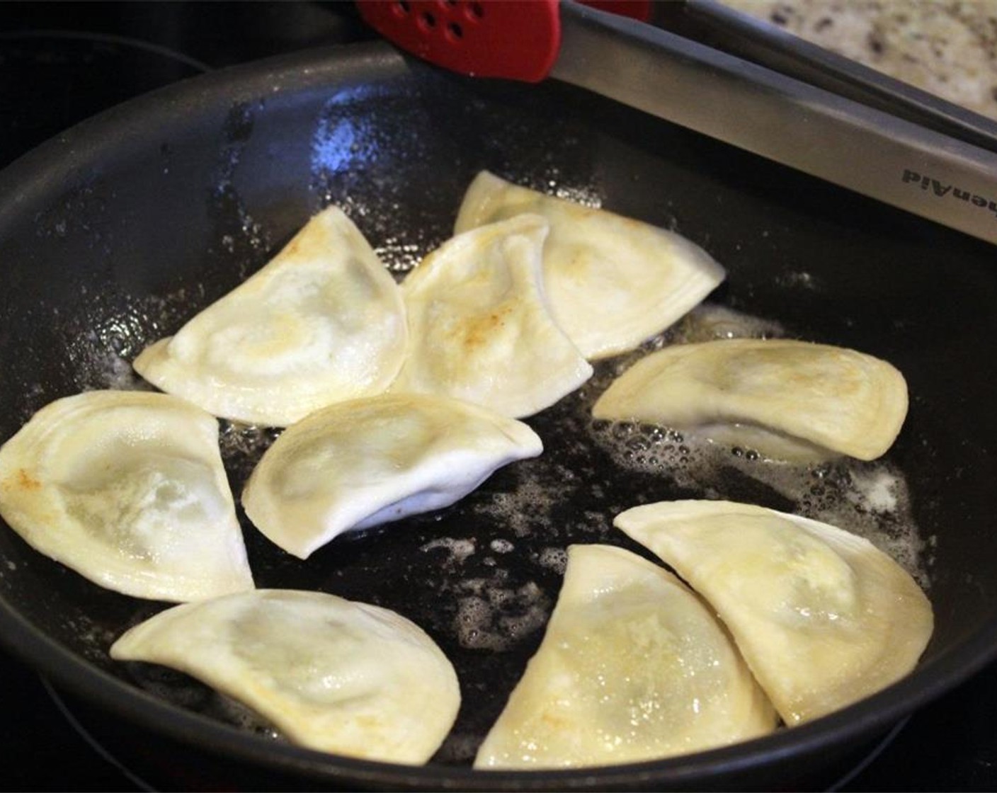 step 3 Cook the pierogi cook for about 10 minutes, during which time you'll prep the other ingredients. Flip the pierogi every 3 minutes or so - see the nice little brown color?