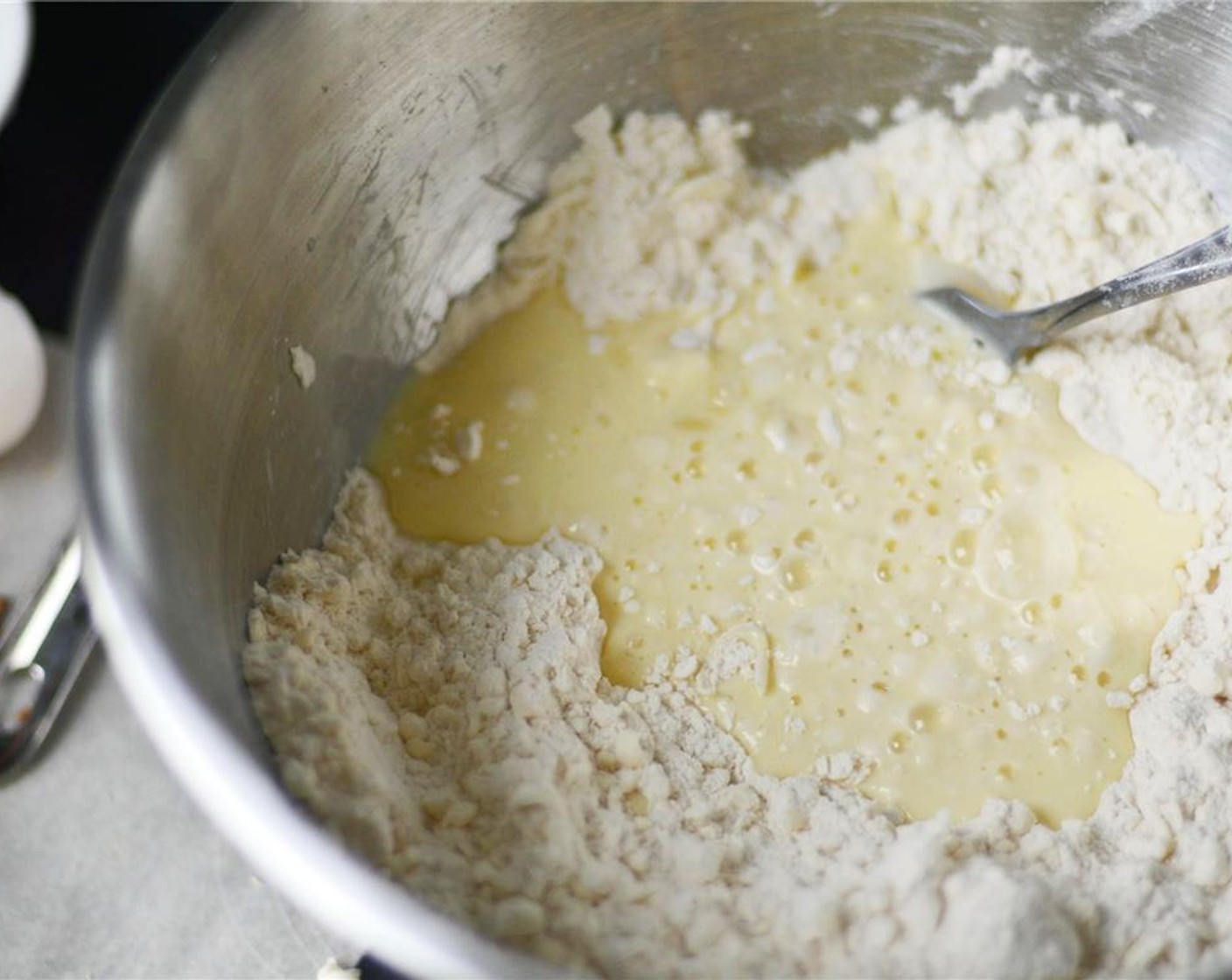 step 5 In a small bowl, whisk together Buttermilk (3/4 cup) and Egg (1). Make a well in the flour/butter mixture and all at once, pour in the buttermilk/egg mixture and stir to form a soft dough. It will be rather shaggy.