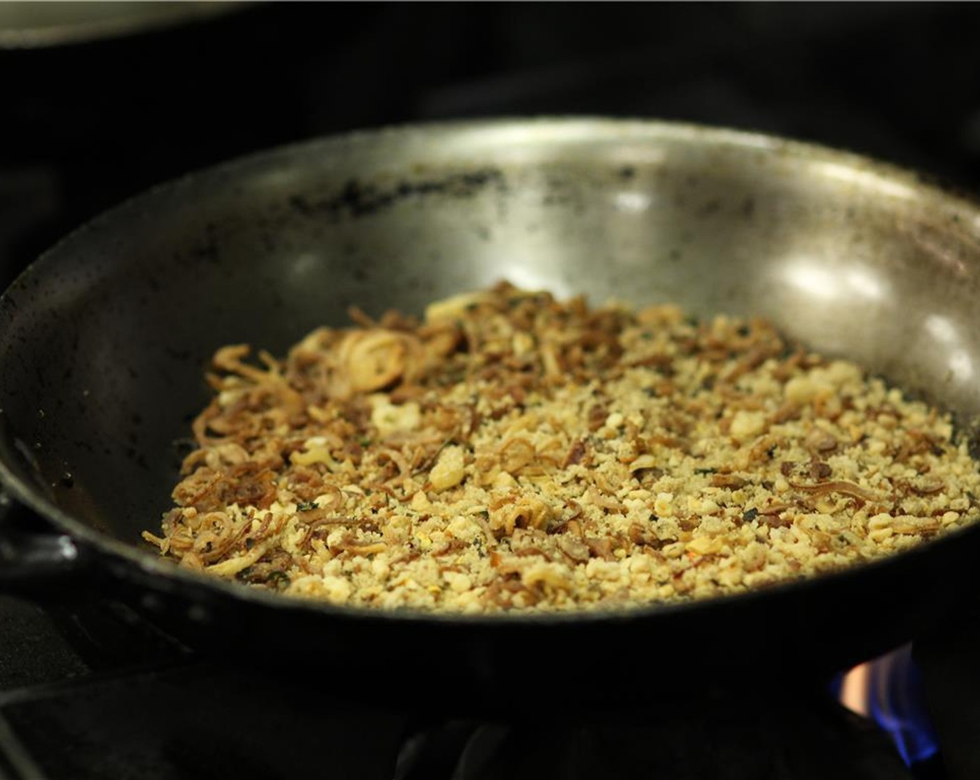 step 4 Cook over medium-high heat with a wooden spoon until sugar begins to caramelize. DO NOT USE YOUR HAND TO TOUCH SUGAR! It will leave a bad burn.