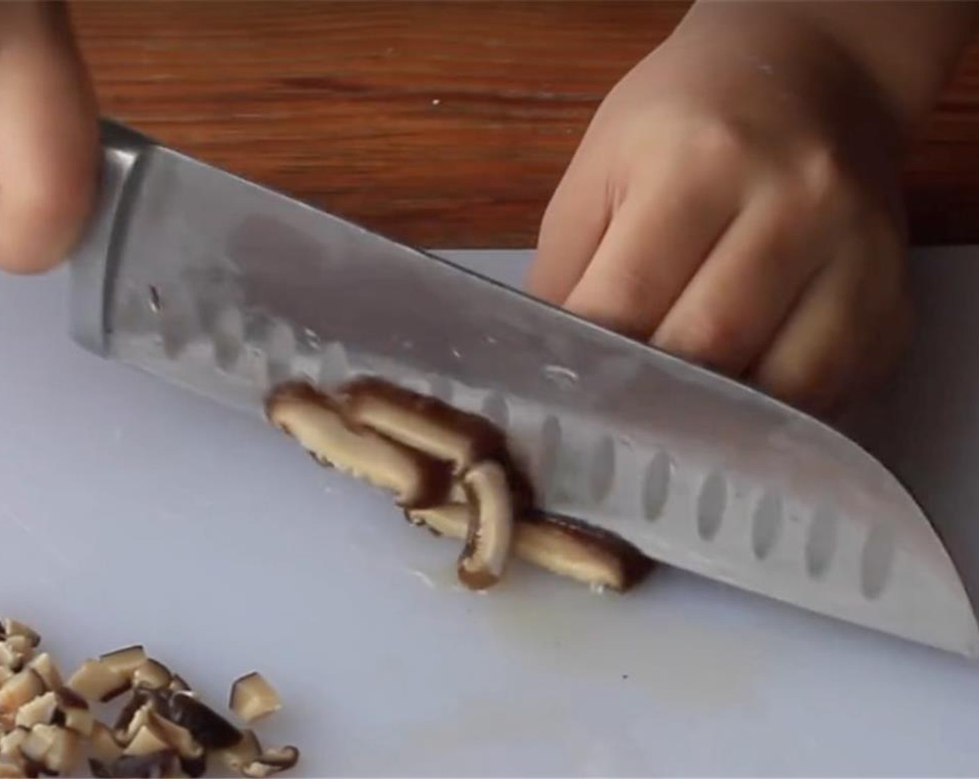 step 4 Remove the mushroom roots and cut into dices. Cut the Carrot (1/2) into dices too.